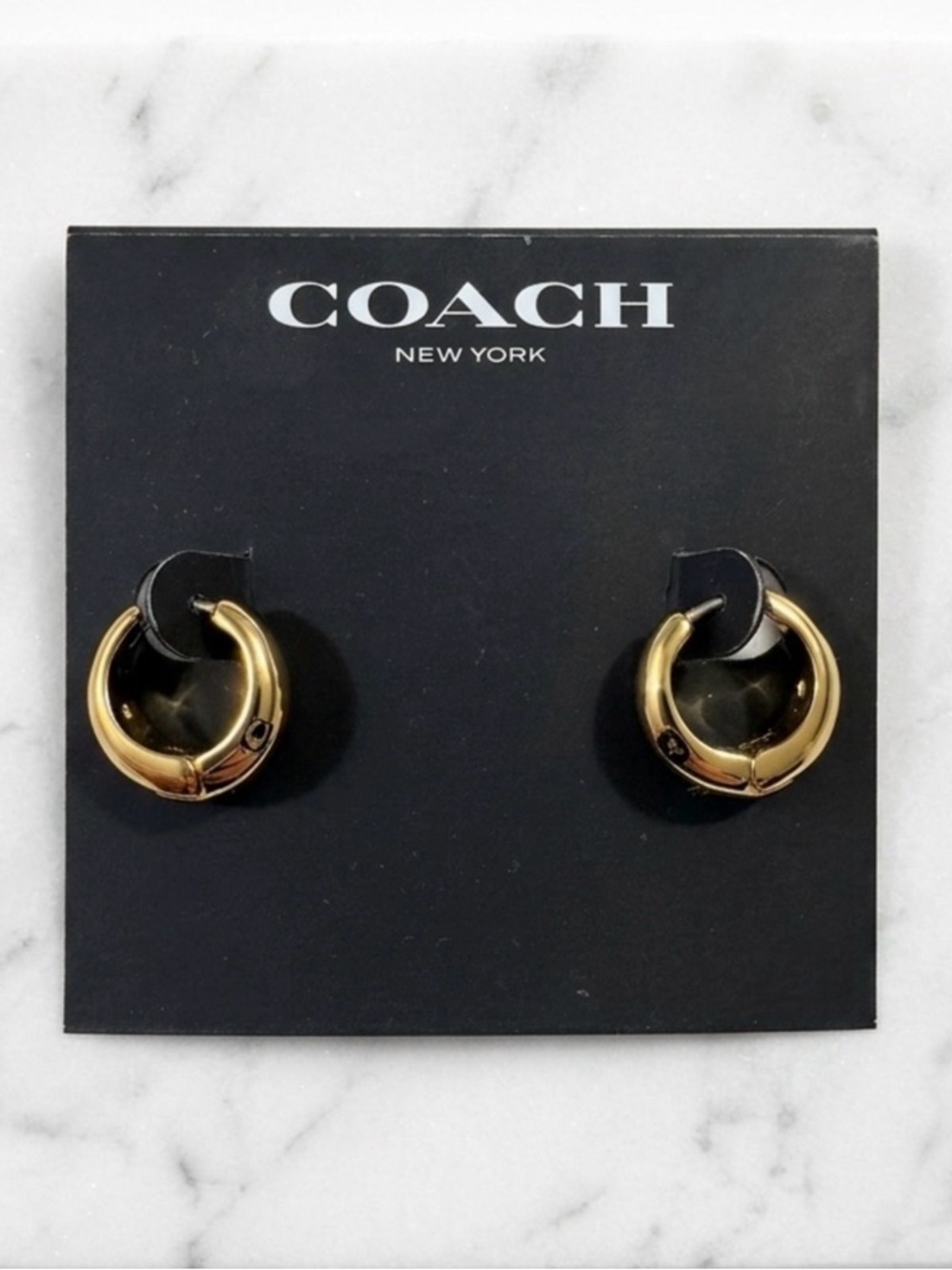 COACH
Signature Hallmark Tubular
Huggies Earrings